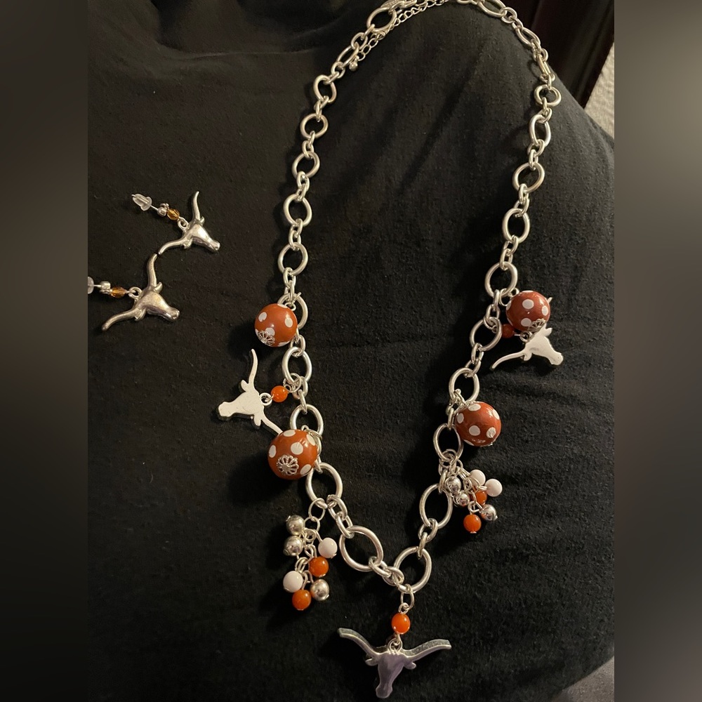 Longhorn necklace and earrings set with Burnt orange and white beads.